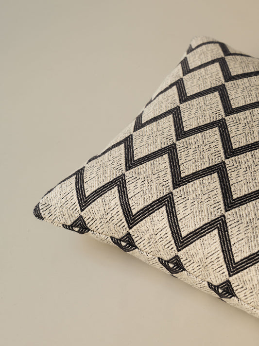 Close-up of the corner of the Papunya – Ombre Naturelle cushion, highlighting the patterned woven fabric and neatly finished seams