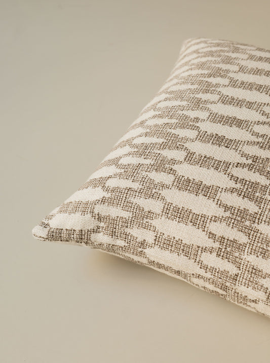 Close-up of the corner of the Birch – Fawn cushion, highlighting the textured fabric and refined finish