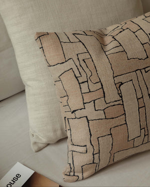 Close-up of the Faded Forms – Large Pair, highlighting the cushions’ soft neutral tones and contrasting woven textures