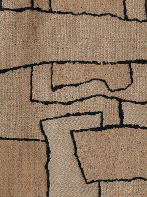 Close-up of the Naoki – Rose des Sables fabric, showing its abstract geometric pattern and textured woven surface