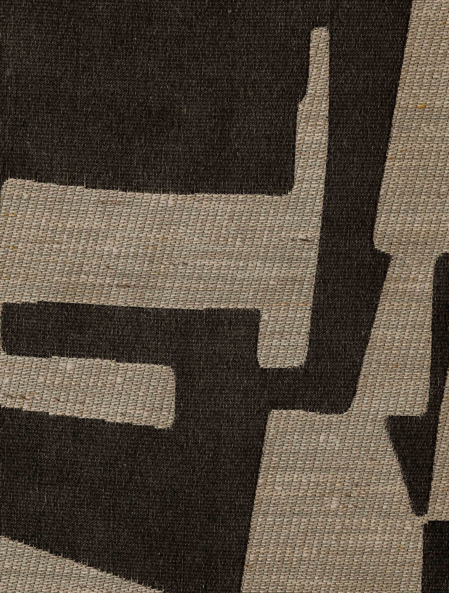 Close-up of the Pazl – Shadow fabric, showing its geometric pattern and textured woven surface