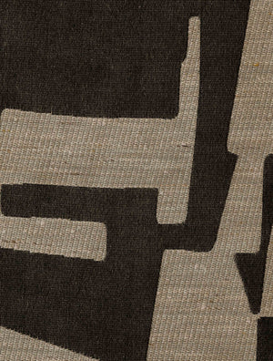 Close-up of the Pazl – Shadow fabric, showing its geometric pattern and textured woven surface