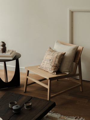 Faded Forms – Small Pair, featuring two textured cushions in soft neutral tones, styled on a wooden chair