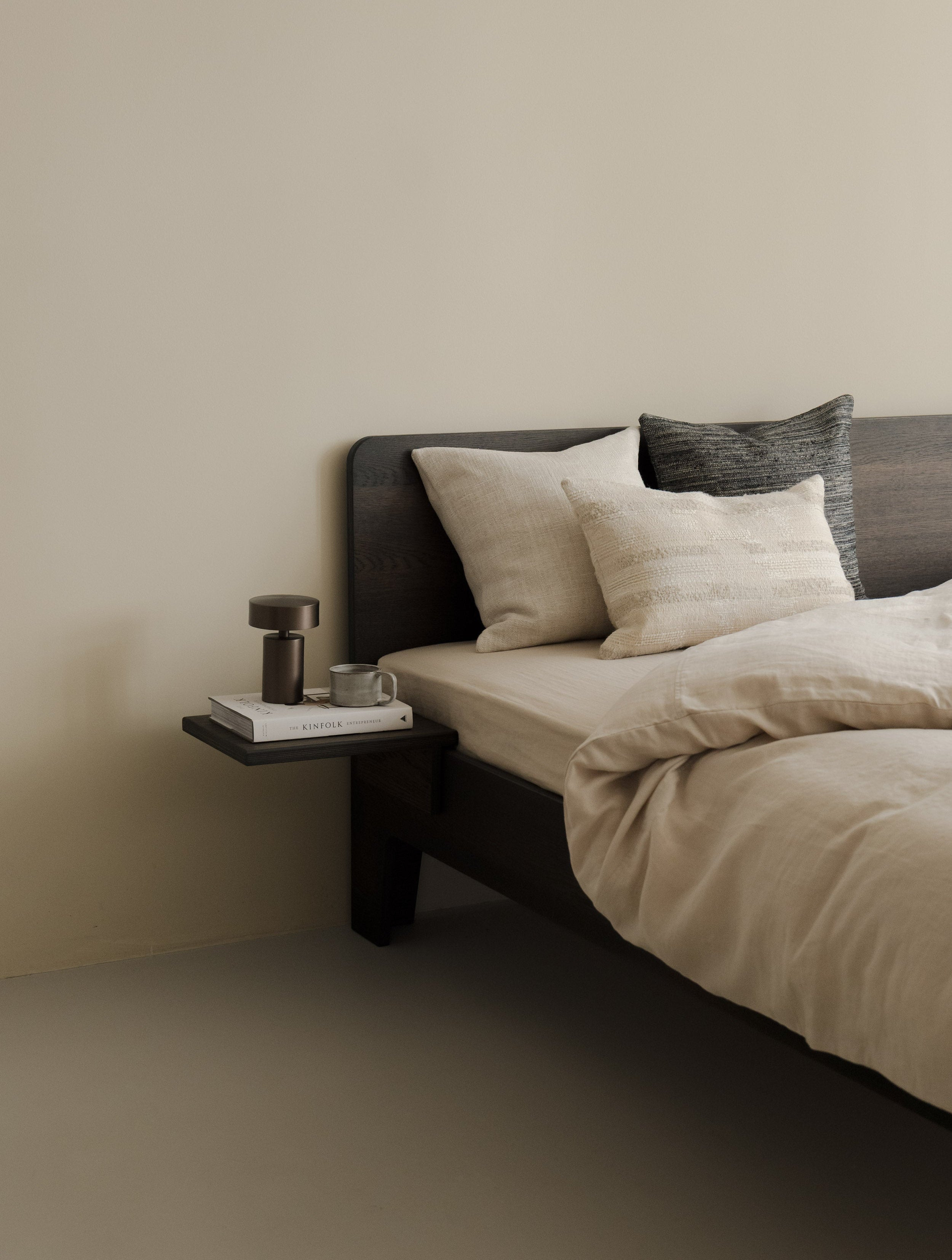 Hints of Blue – Roquebrune trio in natural, brown and muted blue-grey tones, styled on a bed